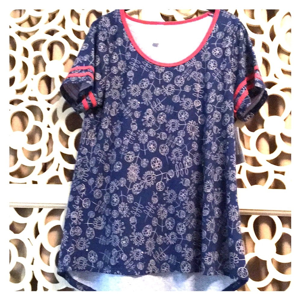Blue tee with pink trim and white designs